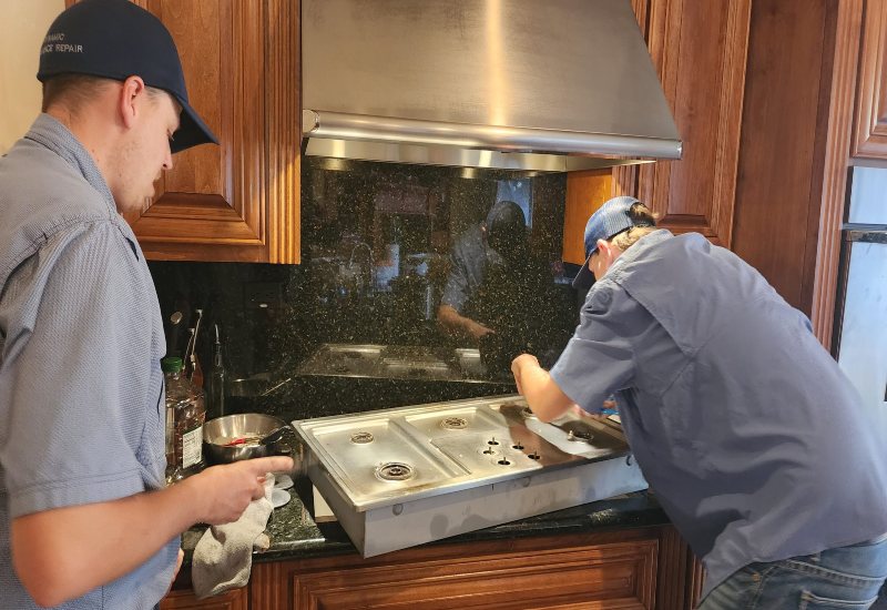 reliable-gas-range-repair Technicians are performing range repair in a kitchen in Gilbert & Fountain Hills, AZ
