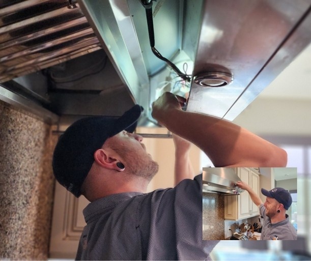 Technician repairing kitchen range hood electrical wiring in Gilbert & Fountain Hills, AZ<br />
